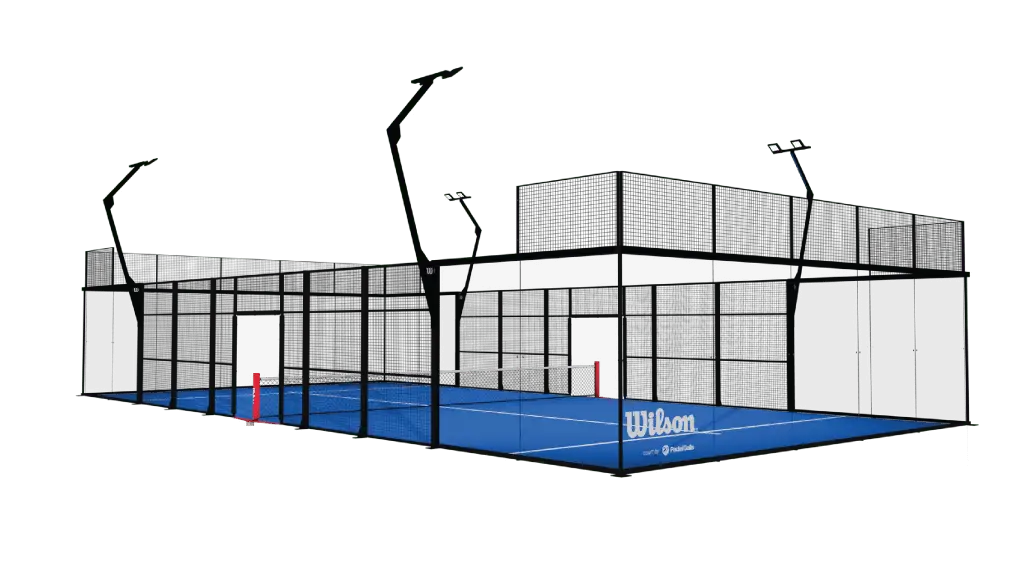 A padel court structure featuring a blue playing surface and illuminated by overhead lights.